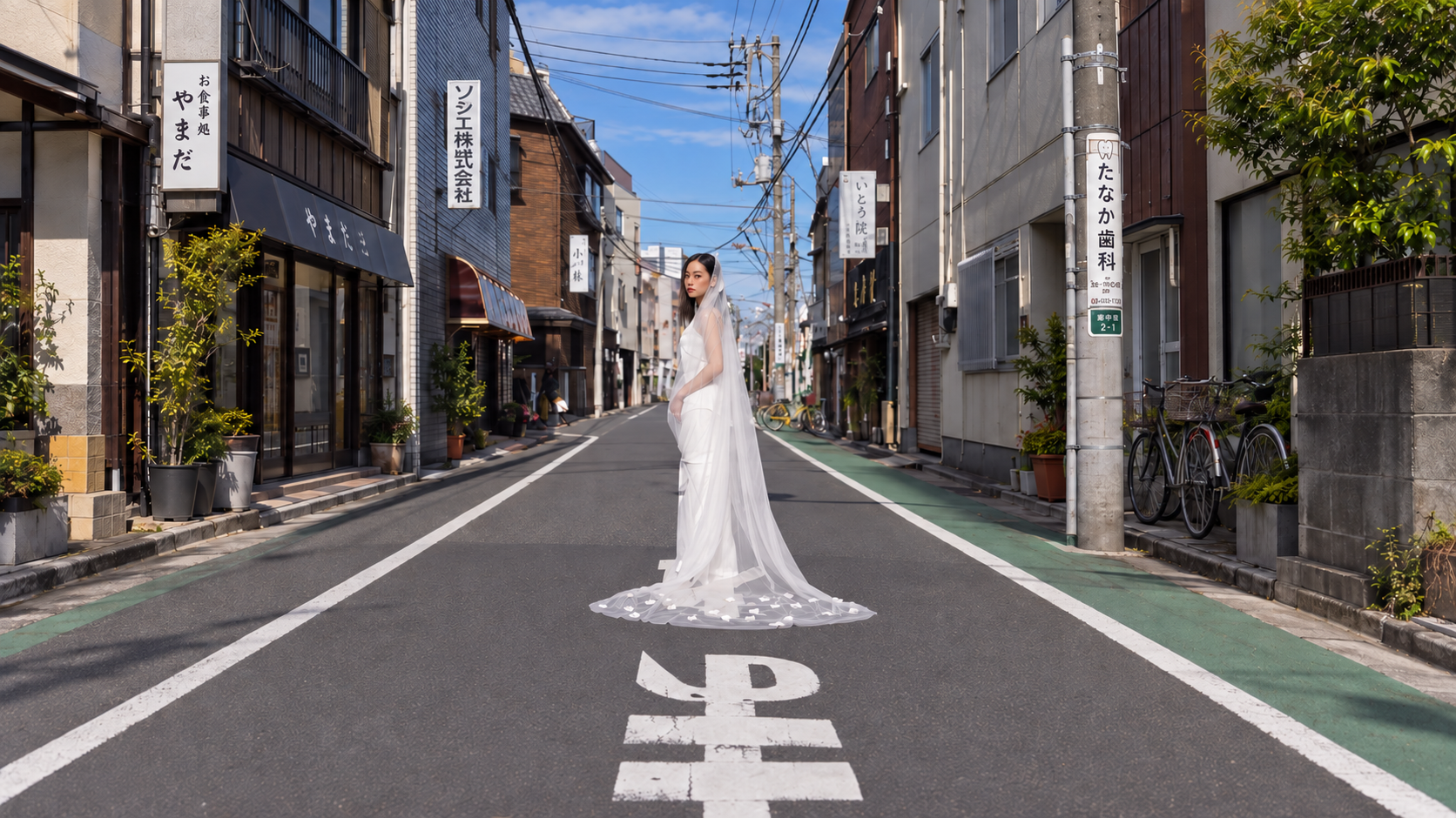 Bride standing in the middle of a Japanese street